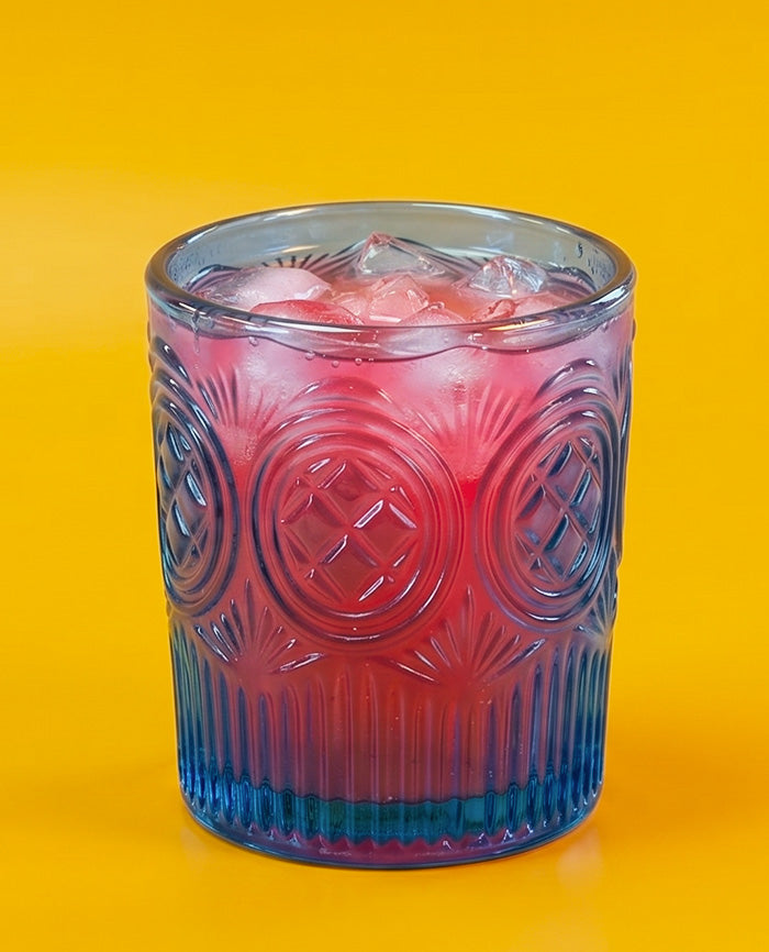 Pink iced drink on a yellow background